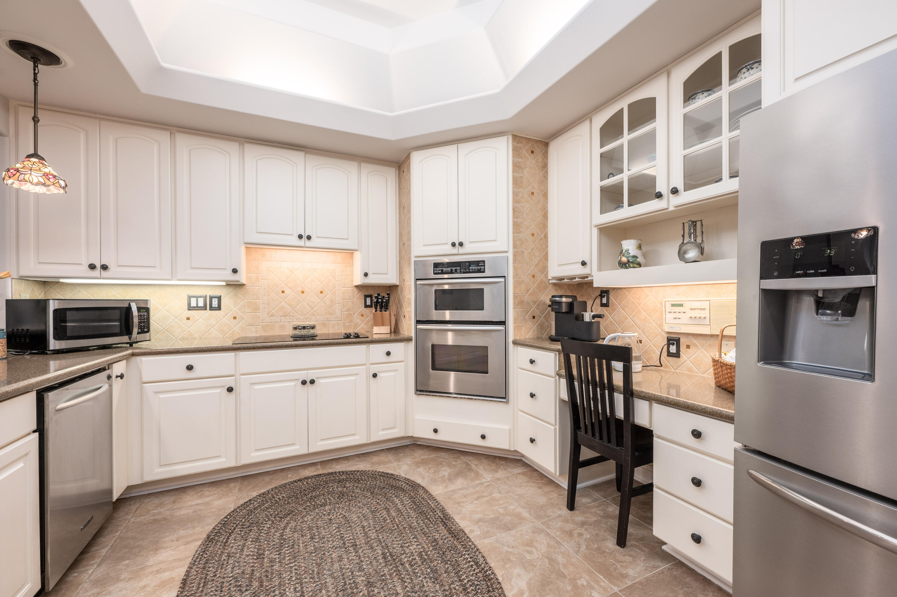 1325 Windrush Cove Niceville, FL 32578 - Photo 21 of 70 a kitchen with stainless steel appliances a stove sink and cabinets