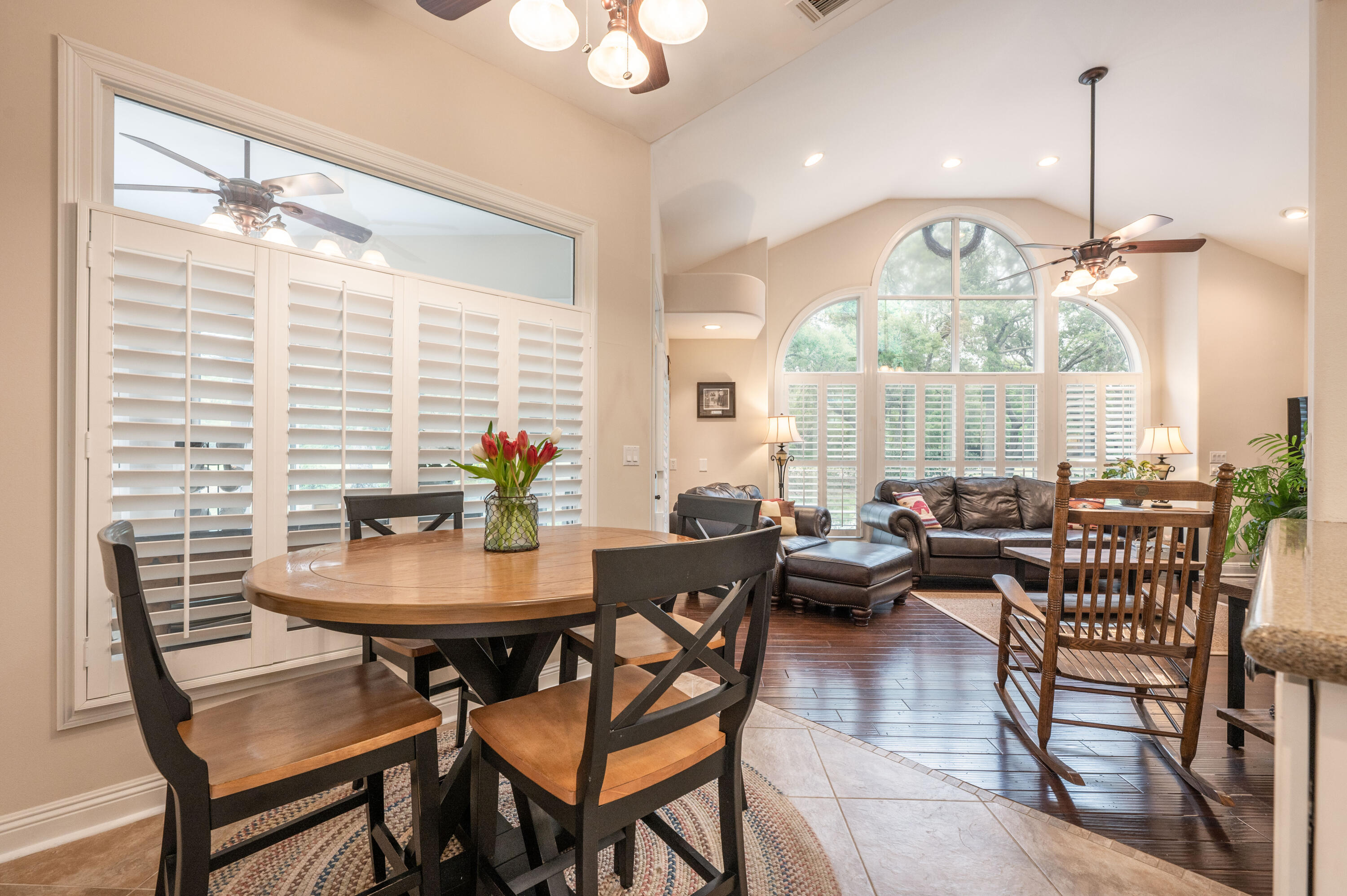 1325 Windrush Cove Niceville, FL 32578 - Photo 23 of 70 a dining room with furniture a chandelier and wooden floor
