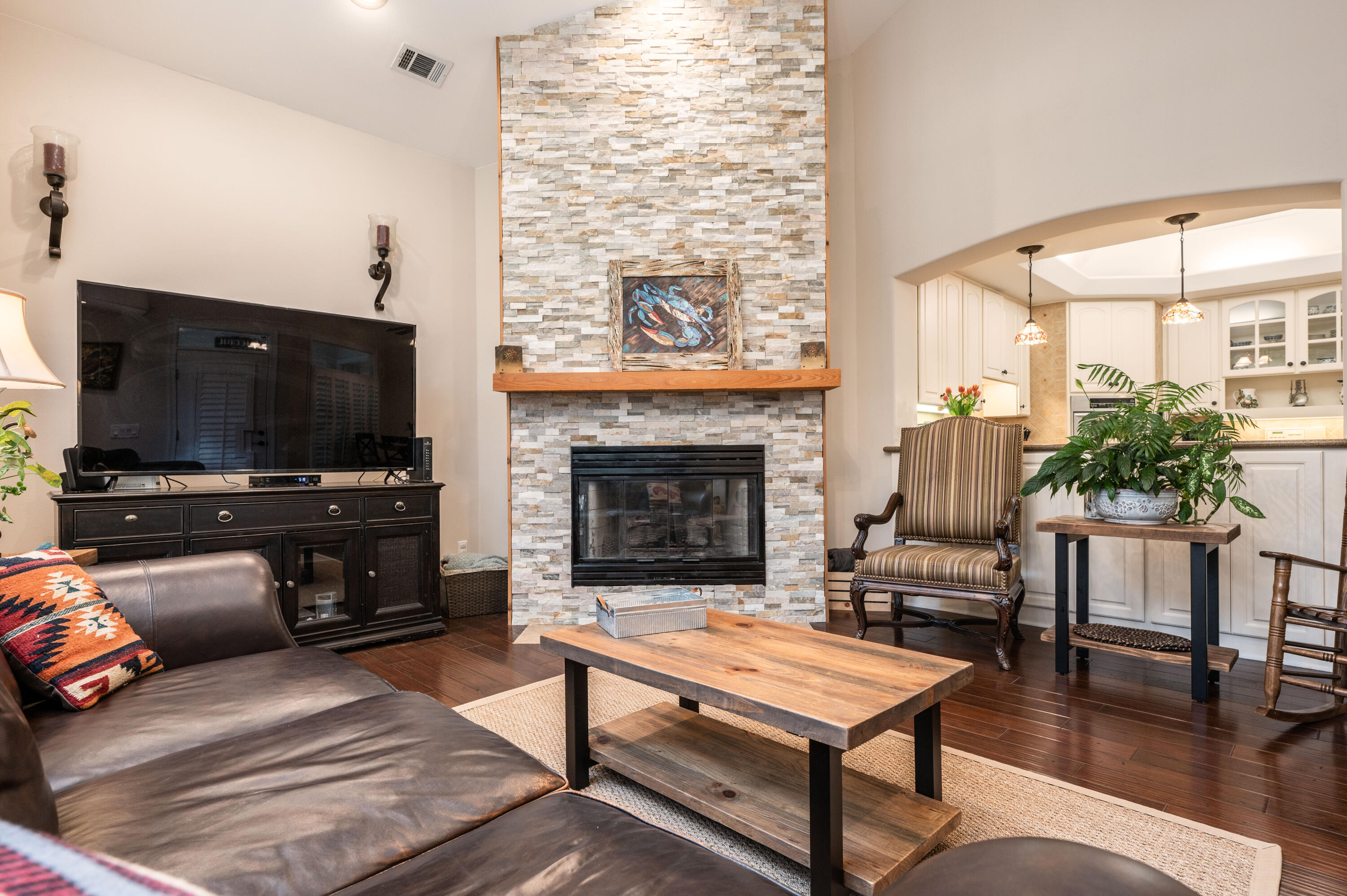 1325 Windrush Cove Niceville, FL 32578 - Photo 27 of 70 a living room with furniture a flat screen tv and a fireplace