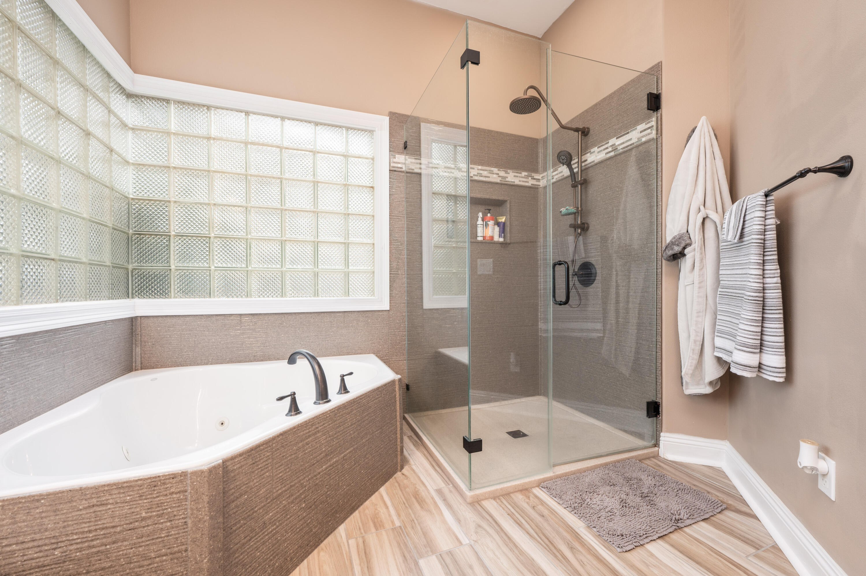 1325 Windrush Cove Niceville, FL 32578 - Photo 39 of 70 a bathroom with a bathtub and a shower