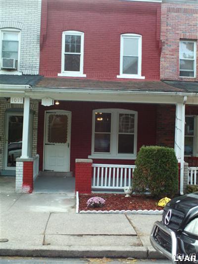 1019 Spring Street Bethlehem, PA 18018 - Photo 1 of 27 a view of a brick building with many windows