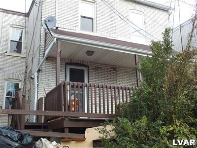 1019 Spring Street Bethlehem, PA 18018 - Photo 3 of 27 a view of brick house with large windows