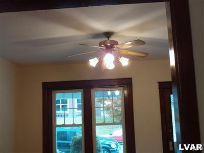 1019 Spring Street Bethlehem, PA 18018 - Photo 7 of 27 a view of a livingroom with a ceiling fan and window