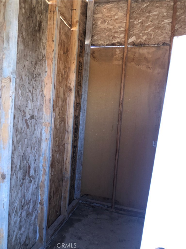 36939 Joy Road Lucerne Valley, CA 92356 - Photo 25 of 30 a bathroom with a glass shower door