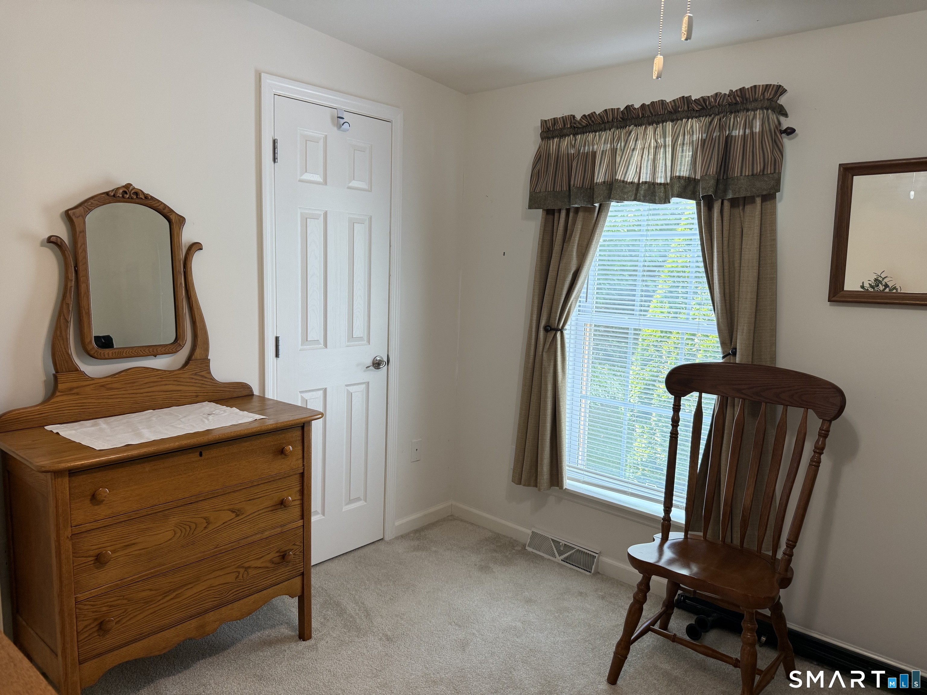 11 Cliff Road Ledyard, CT 06339 - Photo 19 of 28 a room with furniture and a window