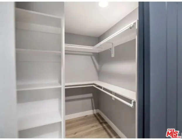 a view of an empty walk in closet