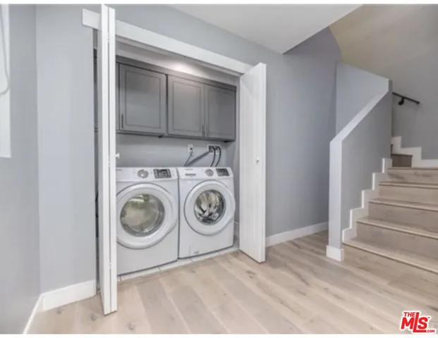 a view of a storage & utility room with washer and dryer
