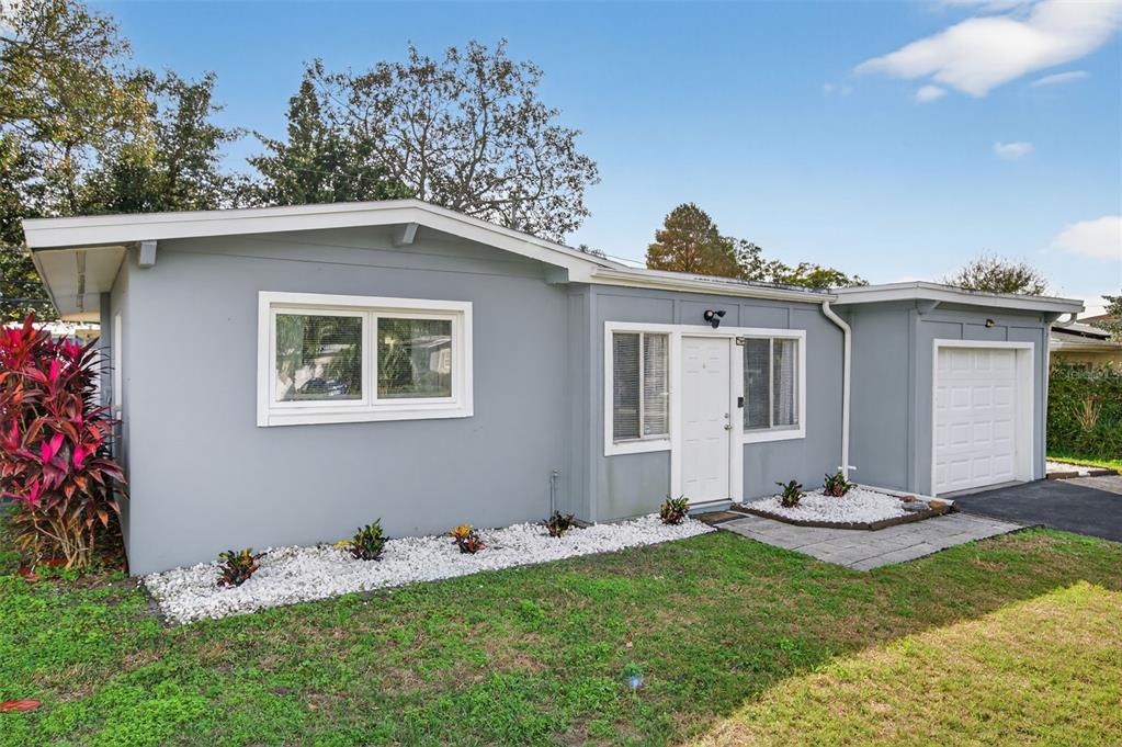 1913 Ridgewood Drive Clearwater, FL 33763 - Photo 1 of 1 a front view of a house with a yard