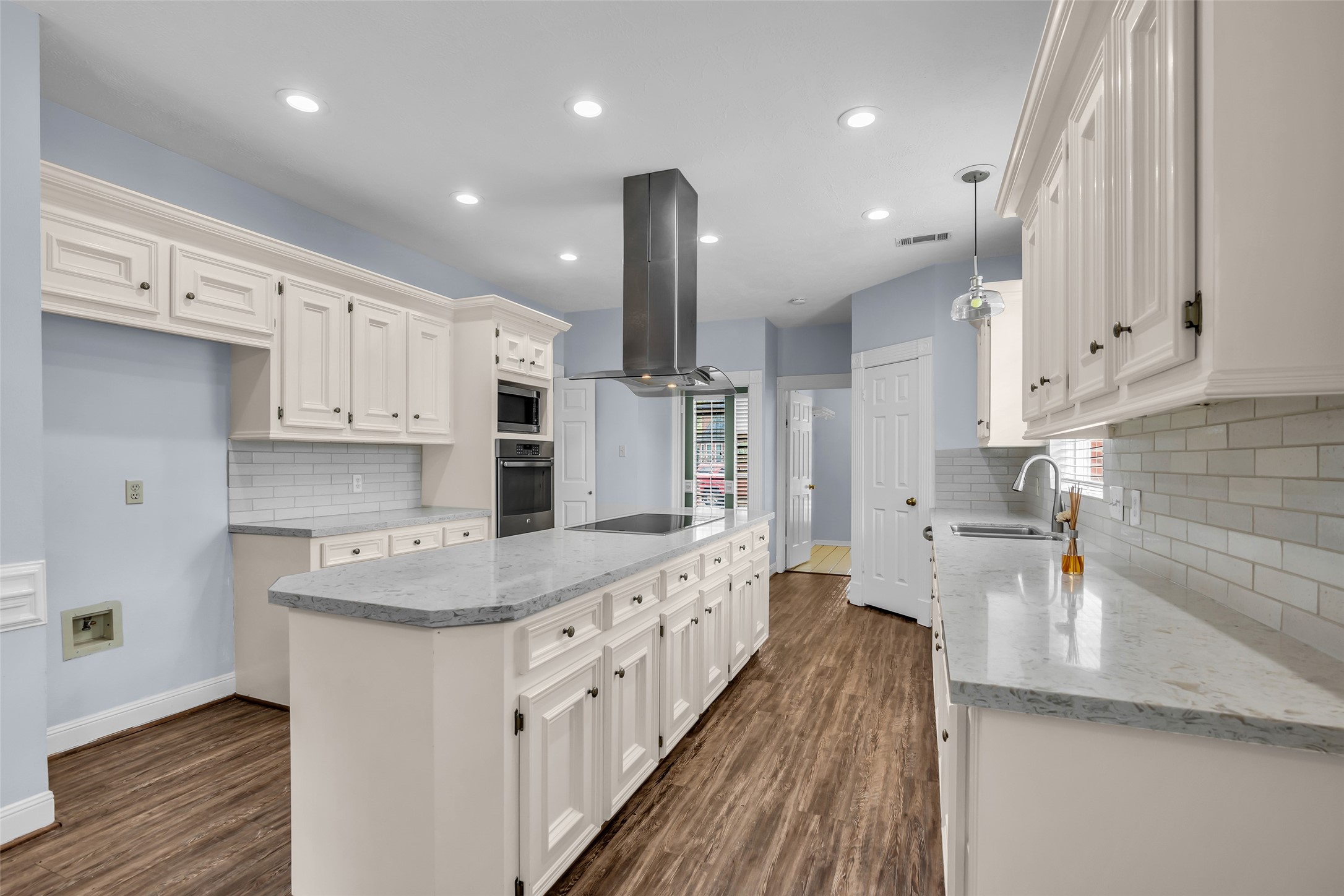 17703 Forest Park Lane Spring, TX 77379 - Photo 13 of 40 a large kitchen with stainless steel appliances kitchen island granite countertop a sink and cabinets