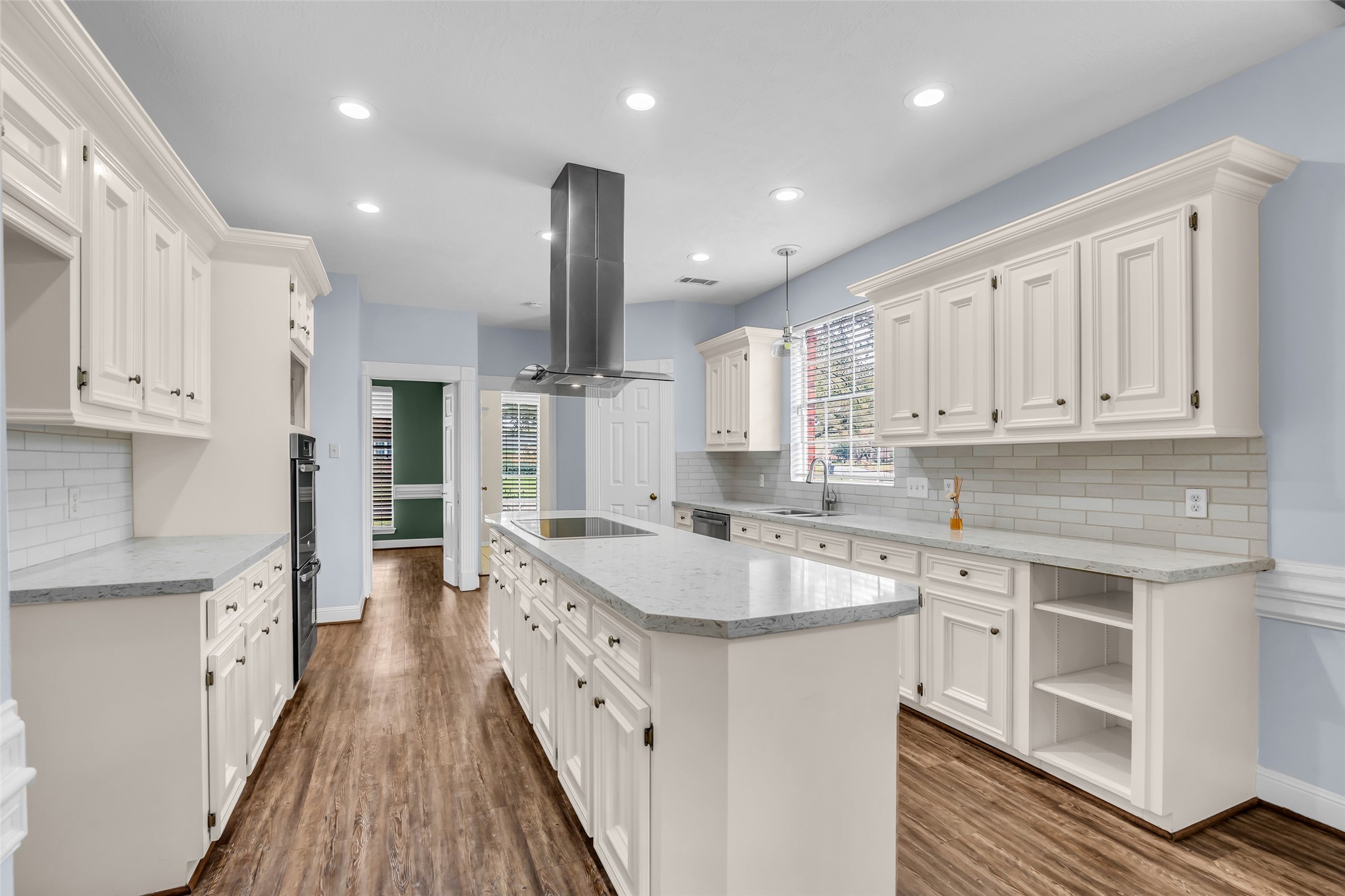 17703 Forest Park Lane Spring, TX 77379 - Photo 14 of 40 a kitchen with stainless steel appliances granite countertop a sink a stove and a refrigerator