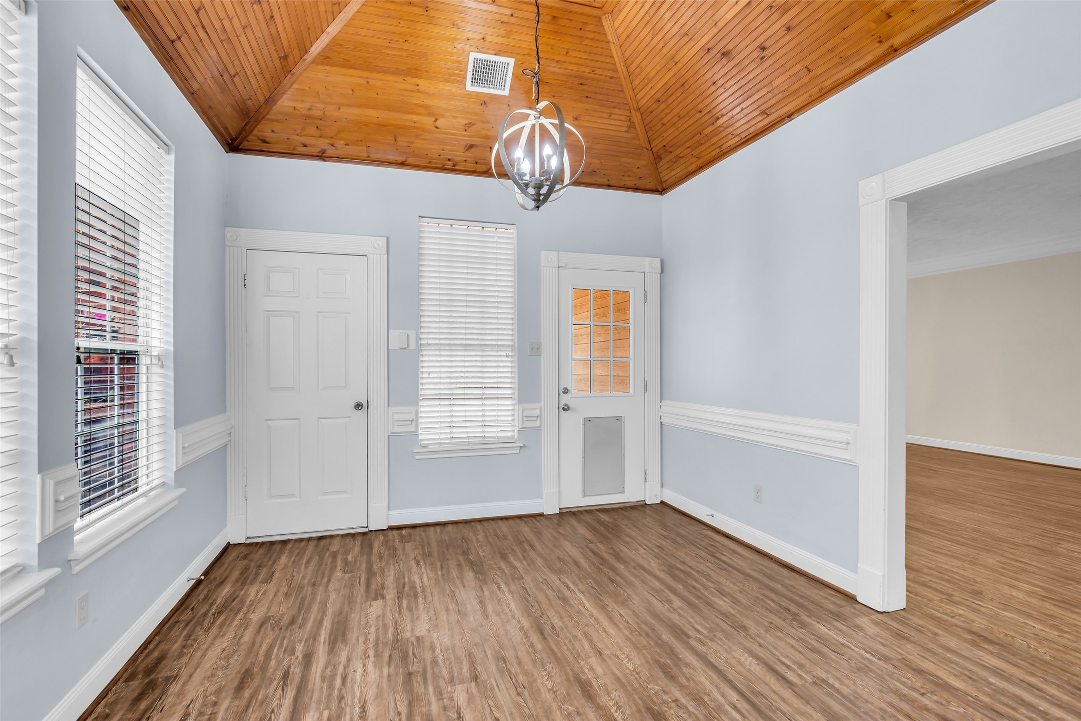 17703 Forest Park Lane Spring, TX 77379 - Photo 15 of 40 a view of empty room with wooden floor and fan