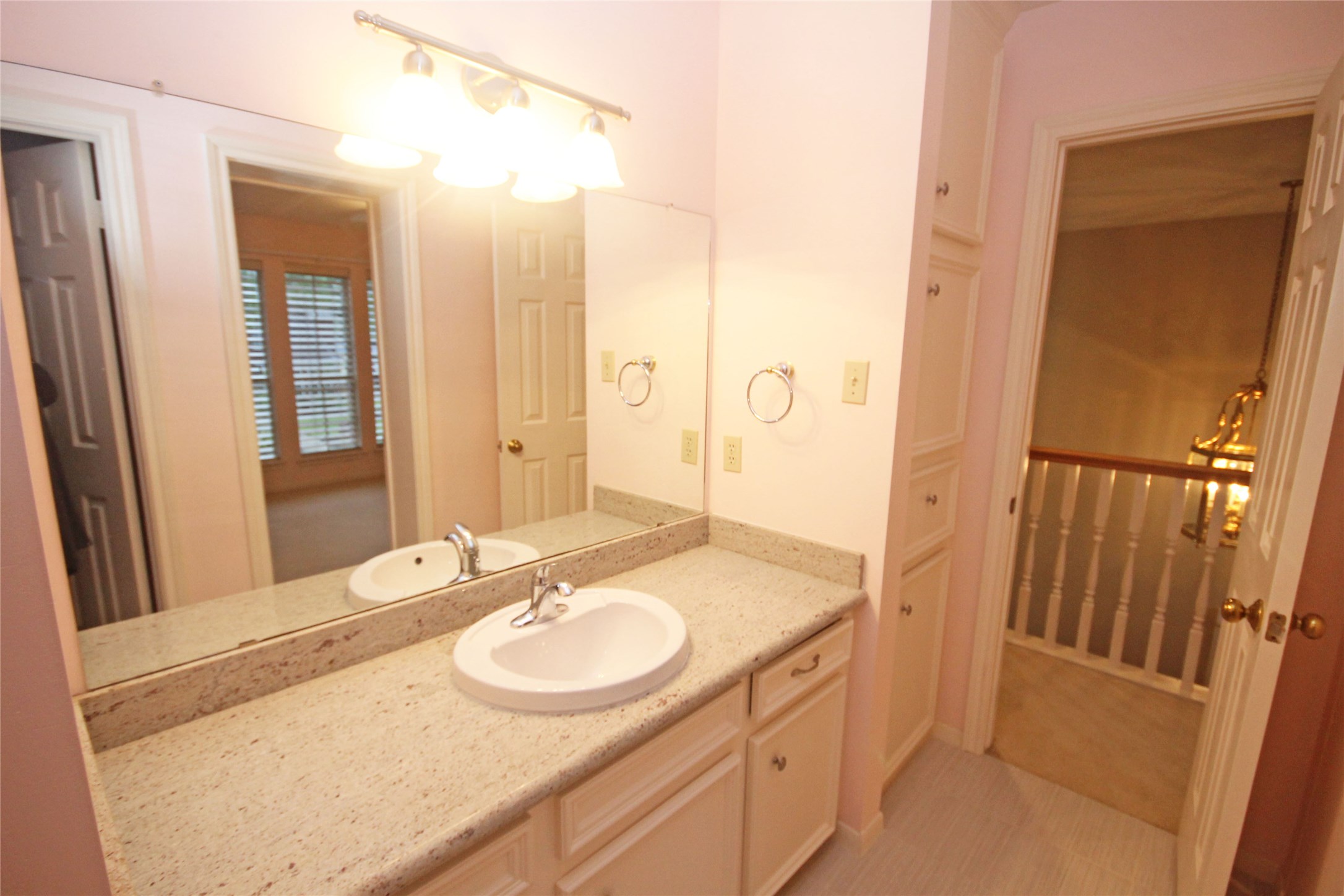 17703 Forest Park Lane Spring, TX 77379 - Photo 30 of 40 a bathroom with a sink and a mirror