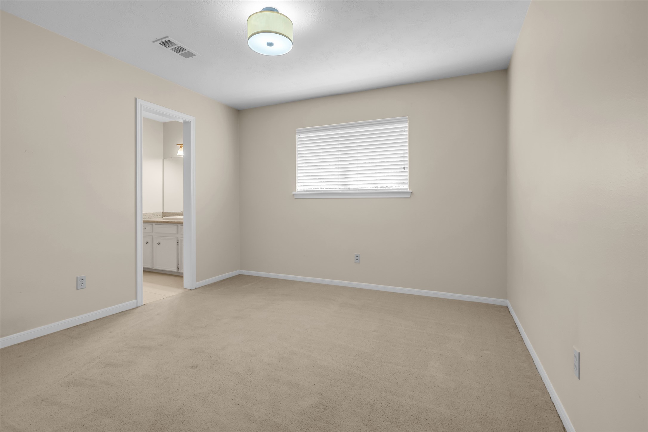 17703 Forest Park Lane Spring, TX 77379 - Photo 32 of 40 an empty room with a window