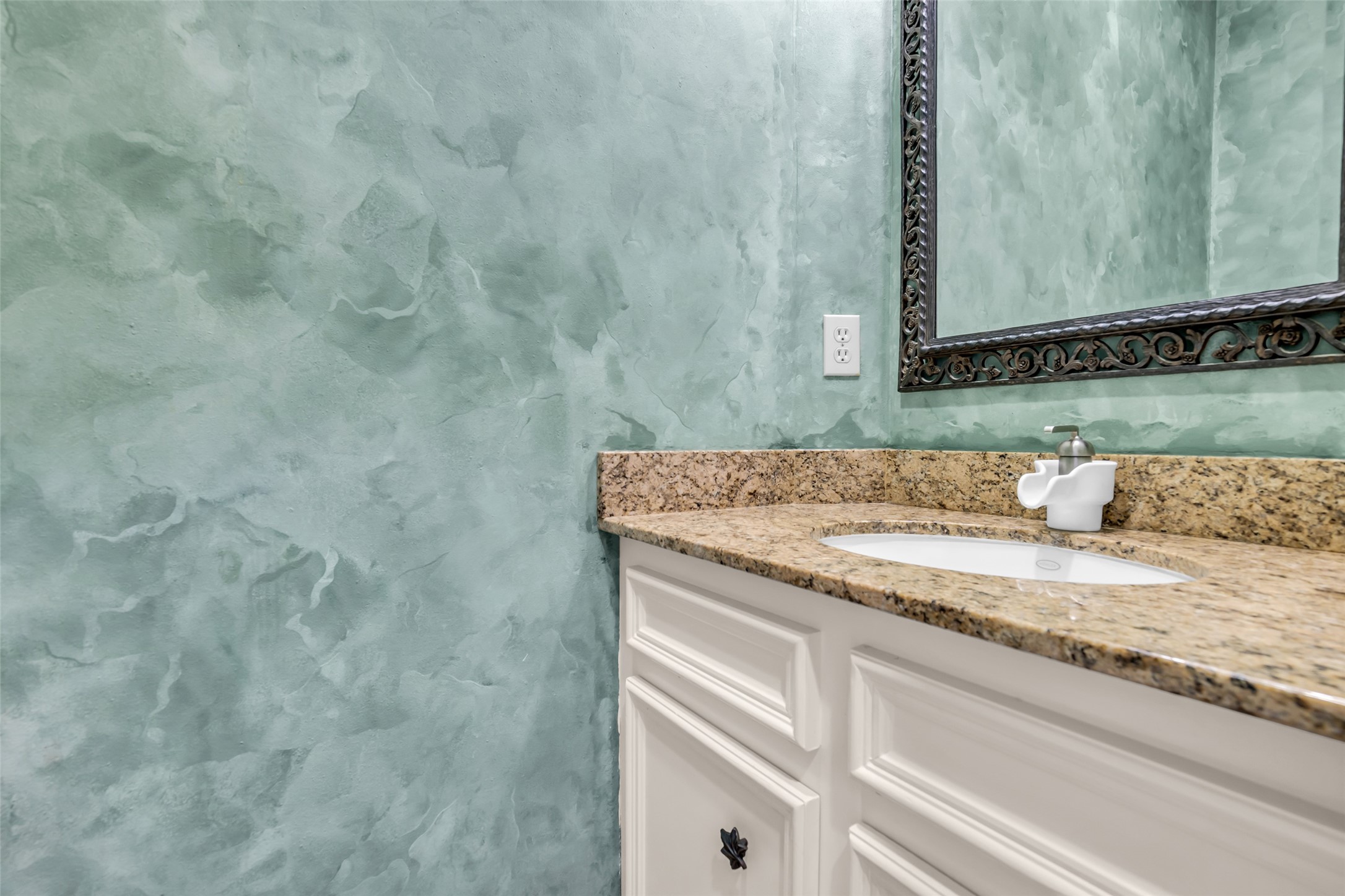 17703 Forest Park Lane Spring, TX 77379 - Photo 35 of 40 a bathroom with a granite countertop sink and mirror
