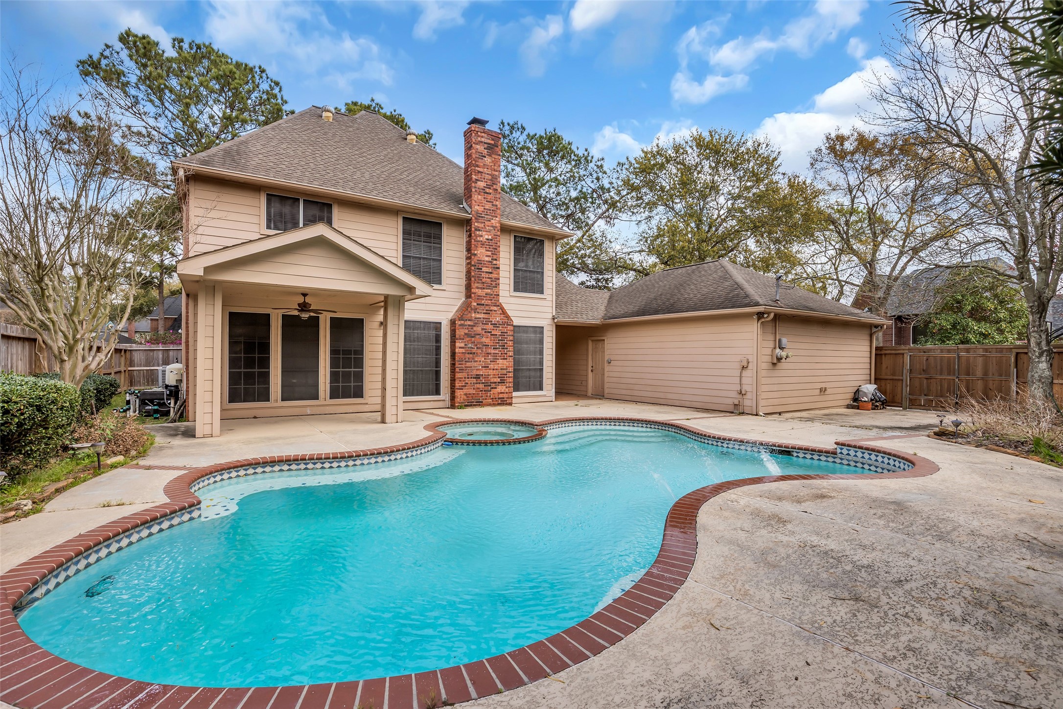 17703 Forest Park Lane Spring, TX 77379 - Photo 38 of 40 a view of a house with swimming pool and porch