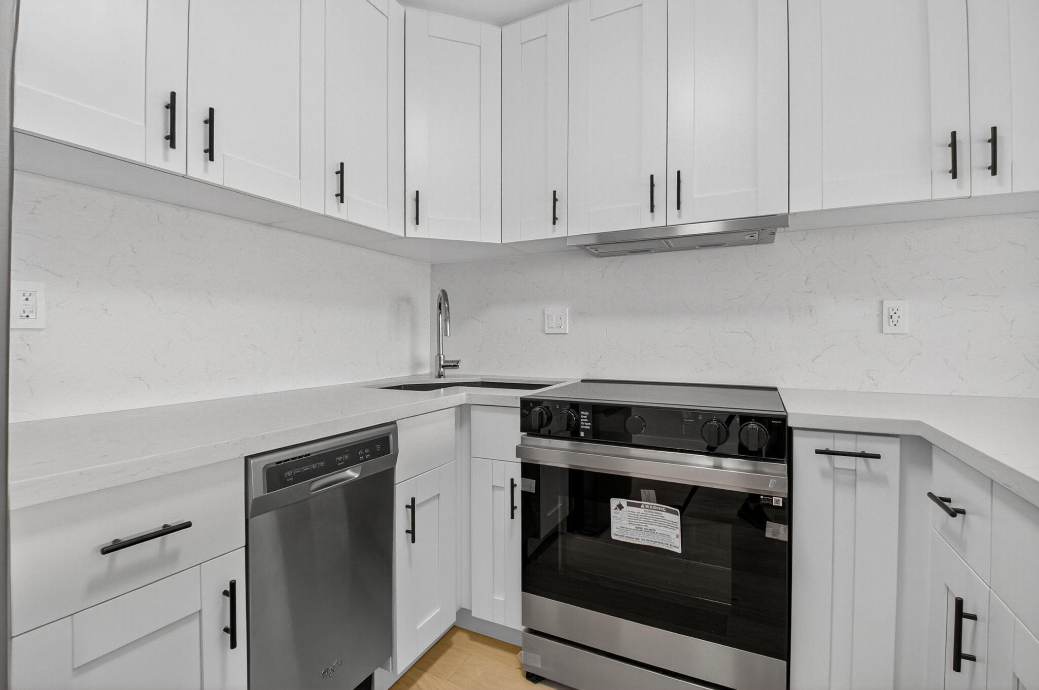 2871 North Ocean Boulevard, Unit V543 Boca Raton, FL 33431 - Photo 12 of 62 a kitchen with granite countertop white cabinets and stainless steel appliances