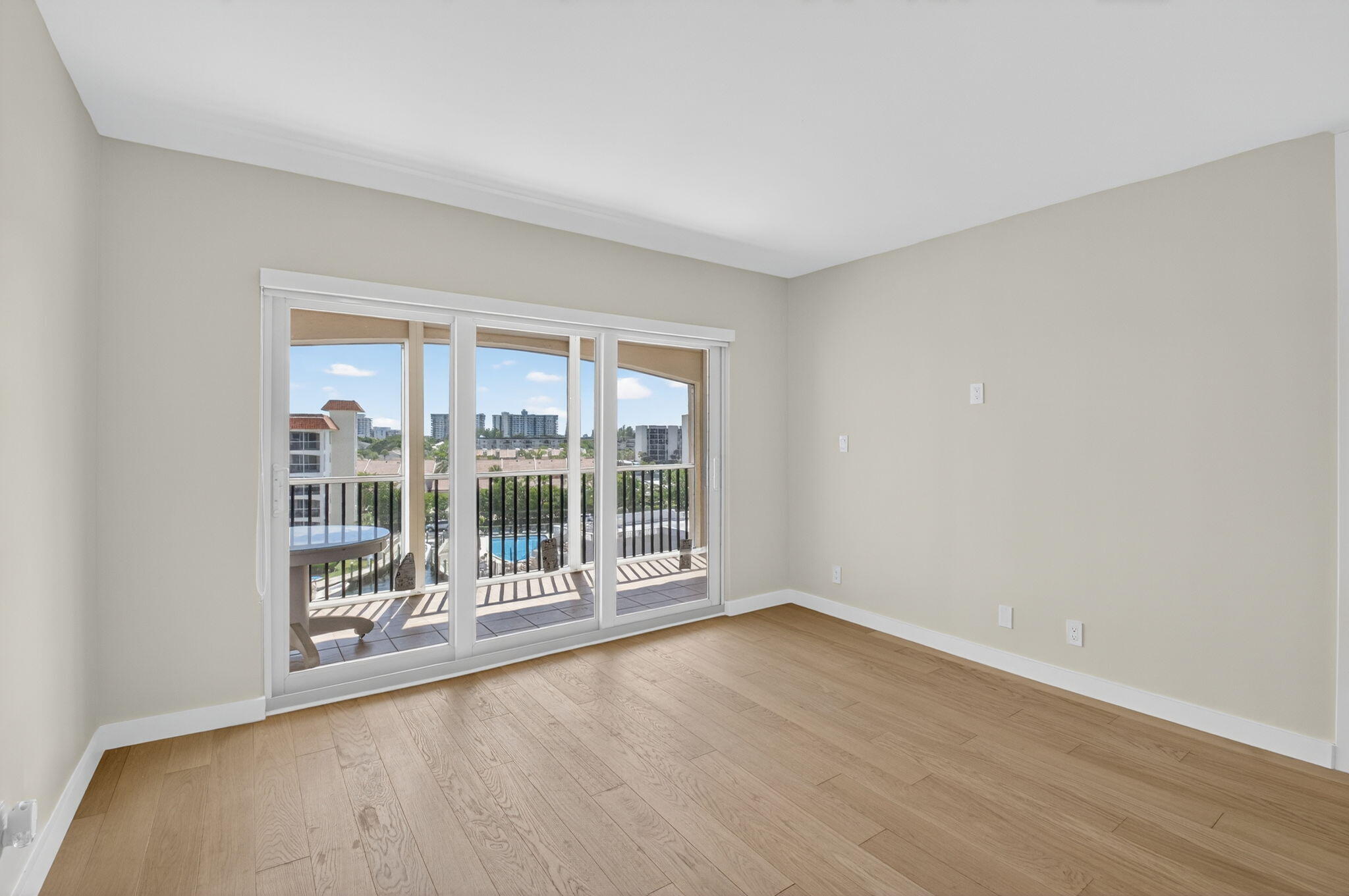 2871 North Ocean Boulevard, Unit V543 Boca Raton, FL 33431 - Photo 14 of 62 wooden floor in an empty room with a window