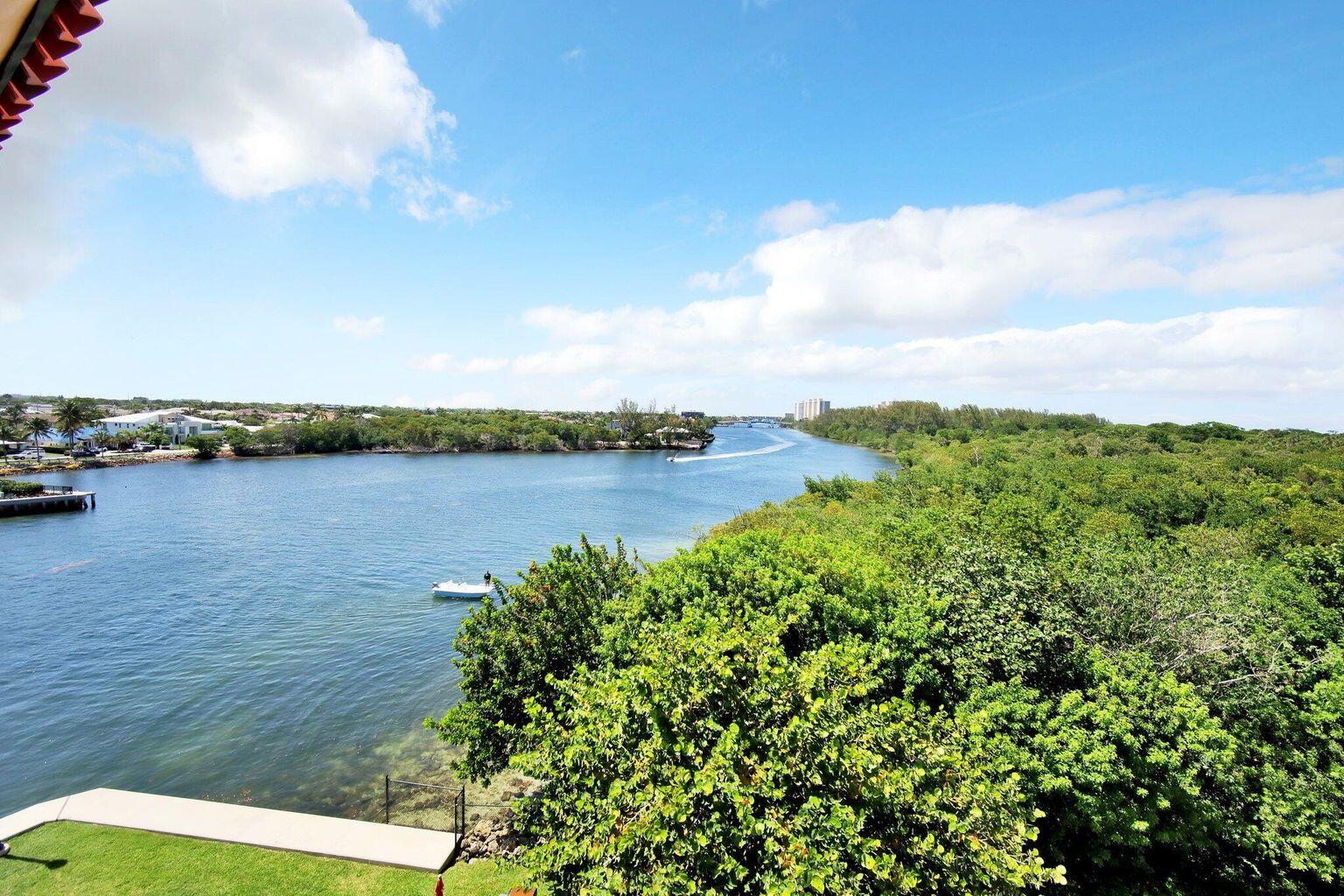 2871 North Ocean Boulevard, Unit V543 Boca Raton, FL 33431 - Photo 2 of 62 a view of a lake with houses in back