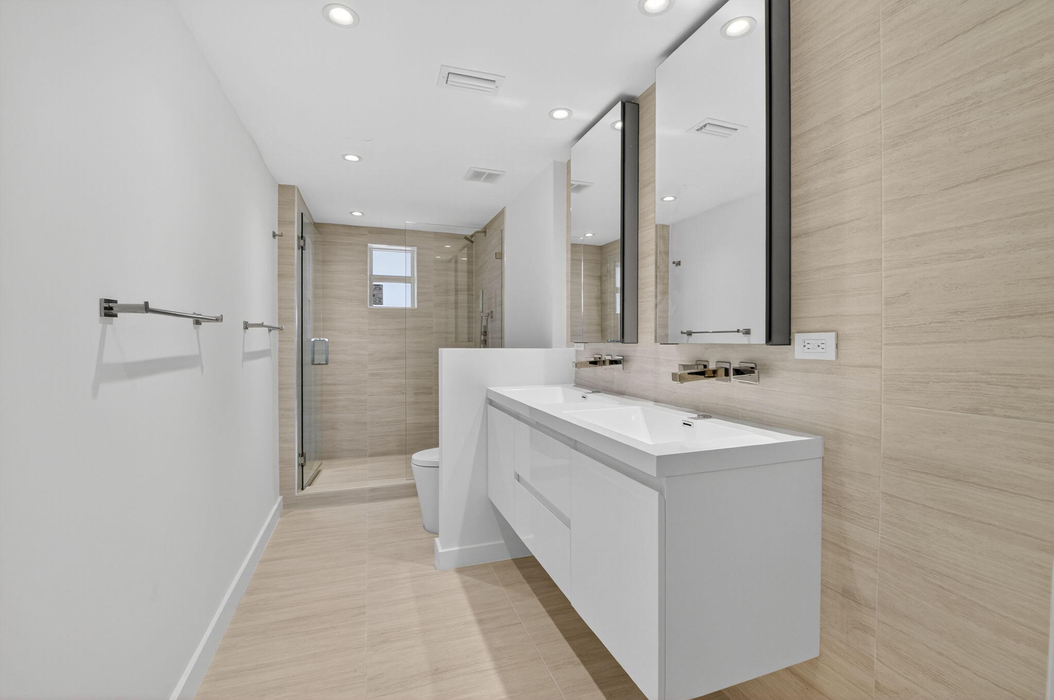 2871 North Ocean Boulevard, Unit V543 Boca Raton, FL 33431 - Photo 27 of 62 a bathroom with a sink a toilet and shower