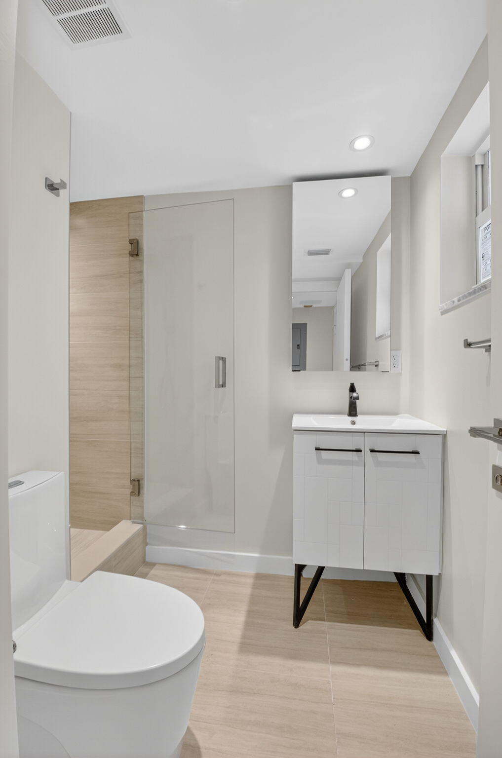 2871 North Ocean Boulevard, Unit V543 Boca Raton, FL 33431 - Photo 30 of 62 a bathroom with a sink a toilet and a mirror