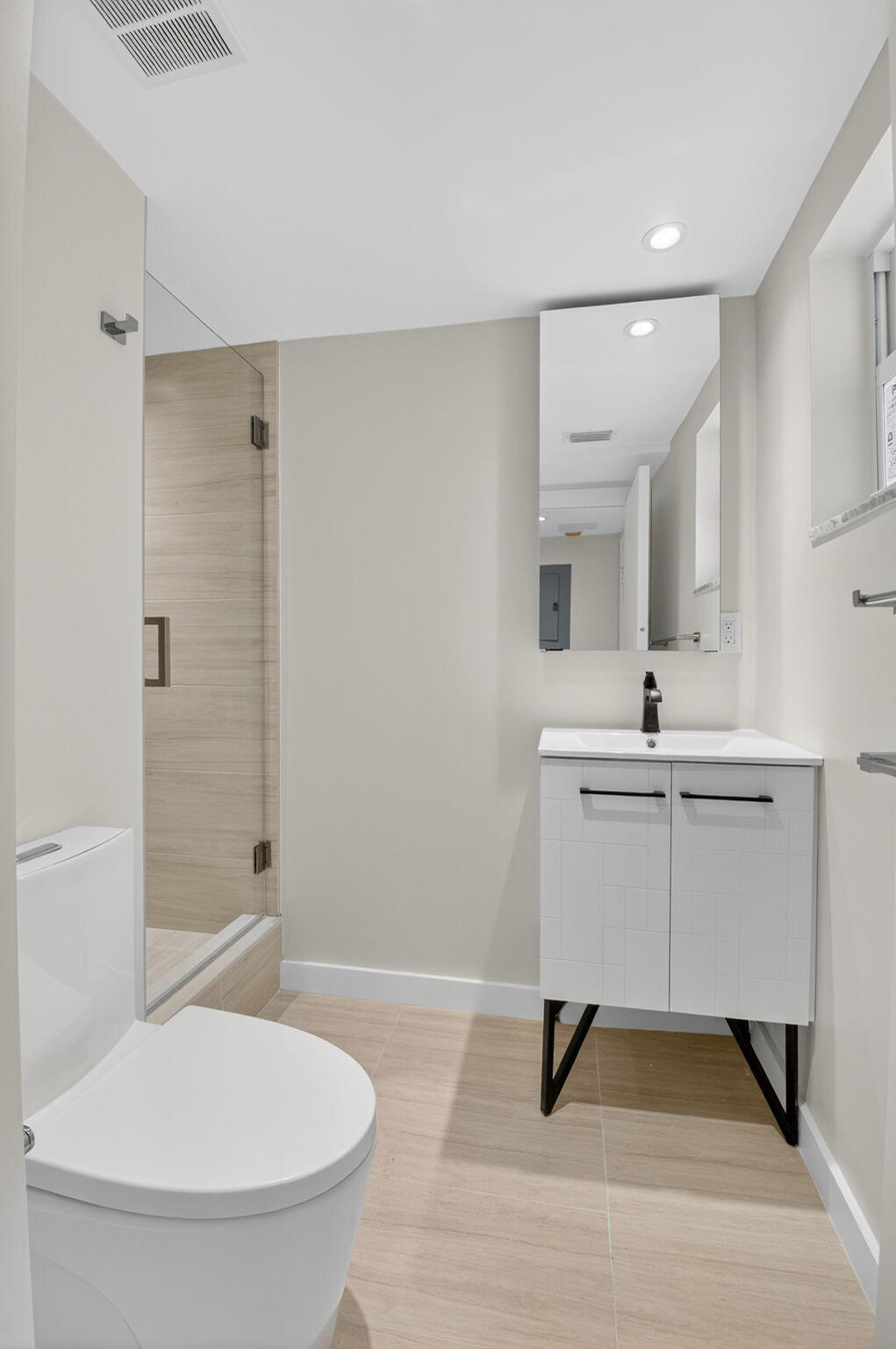 2871 North Ocean Boulevard, Unit V543 Boca Raton, FL 33431 - Photo 31 of 62 a bathroom with a sink a toilet and shower