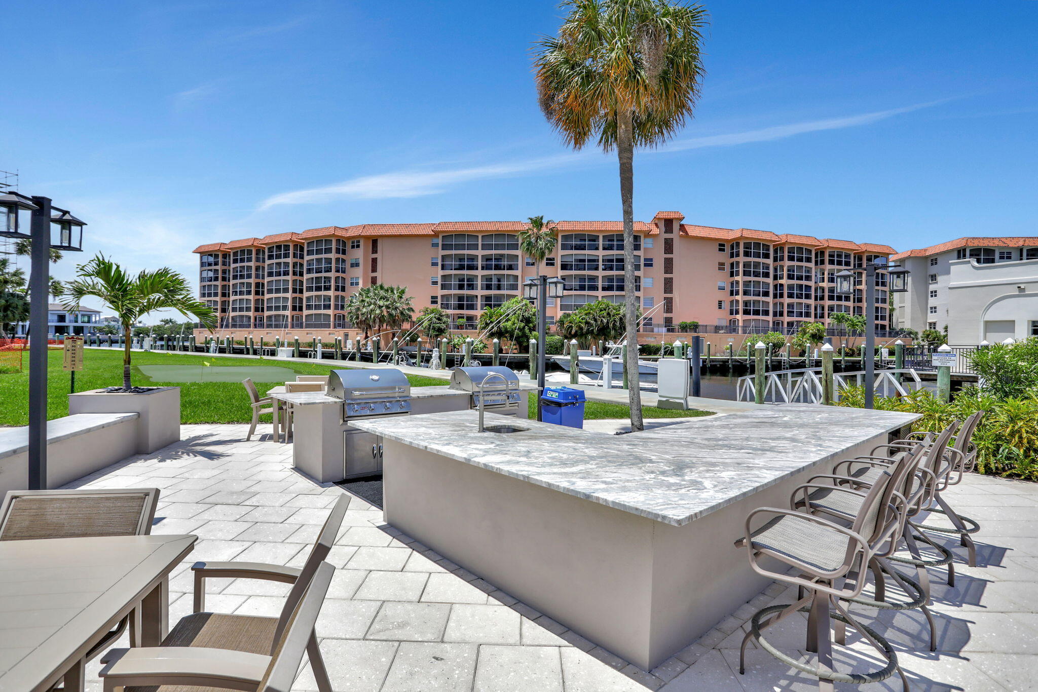 2871 North Ocean Boulevard, Unit V543 Boca Raton, FL 33431 - Photo 38 of 62 a view of a patio with swimming pool