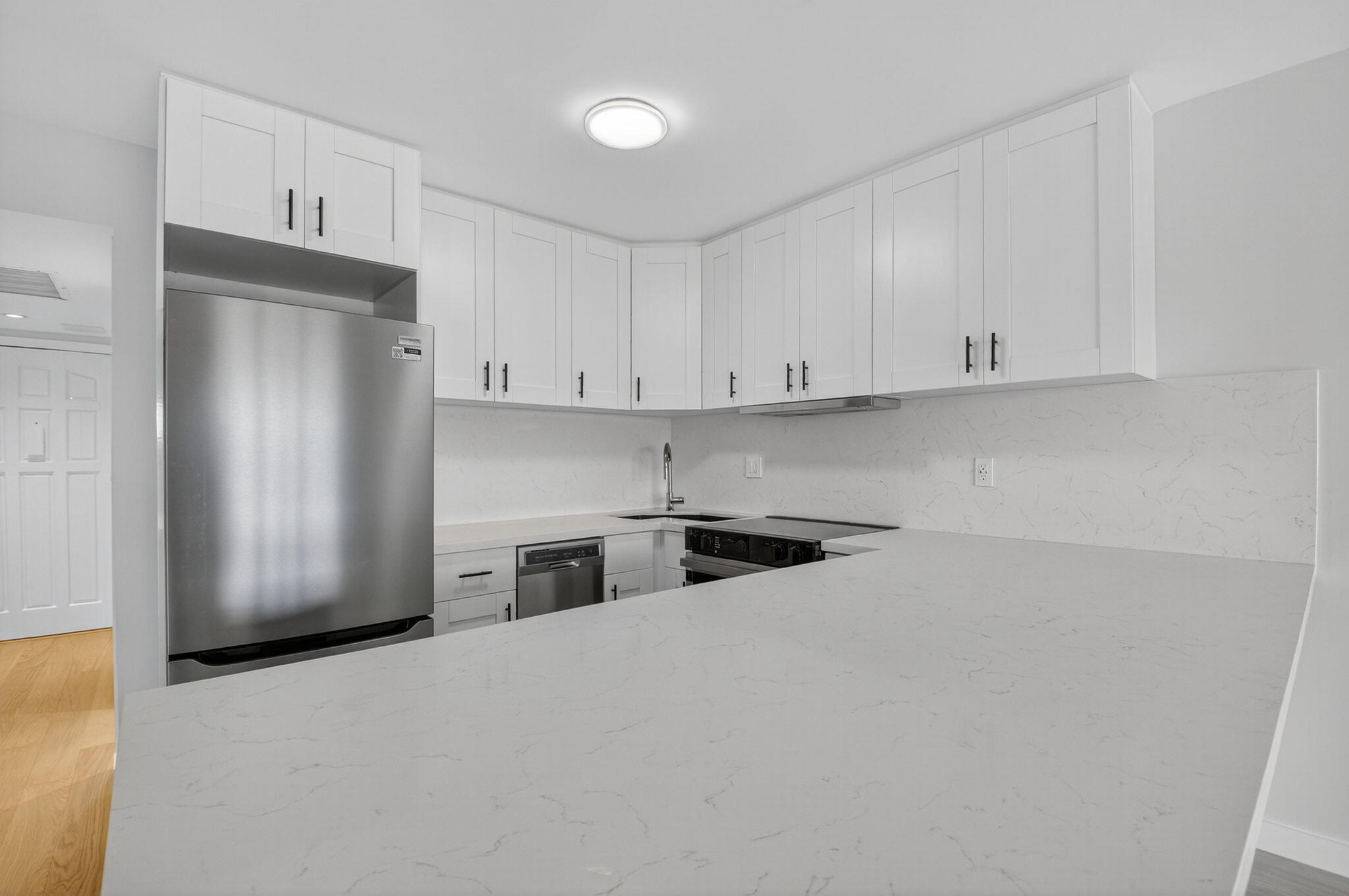 2871 North Ocean Boulevard, Unit V543 Boca Raton, FL 33431 - Photo 8 of 62 a kitchen with stainless steel appliances granite countertop a refrigerator sink and cabinets