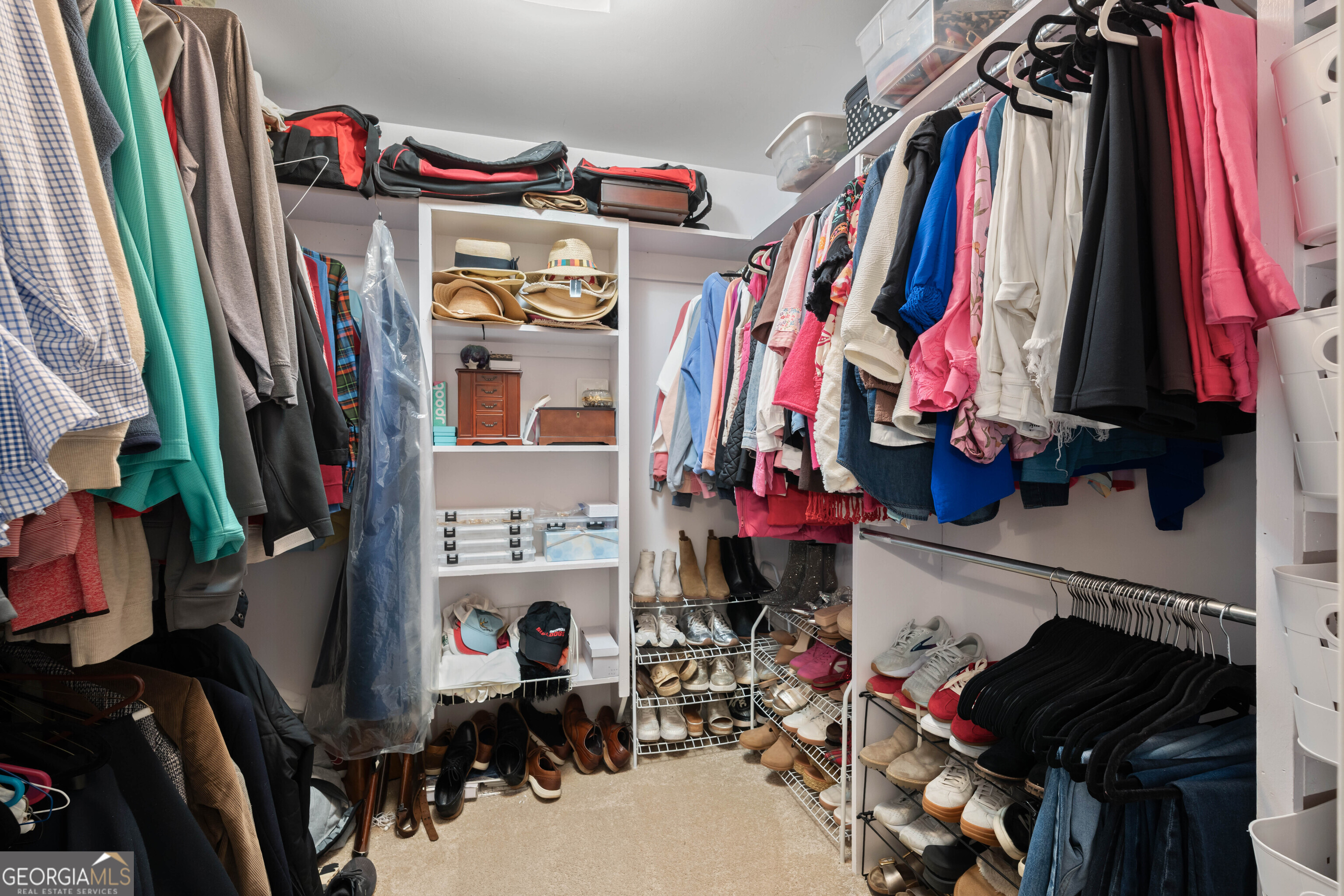 836 Oak Grove Road Carrollton, GA 30117 - Photo 37 of 50 a view of walk in closet with clothes and shoes