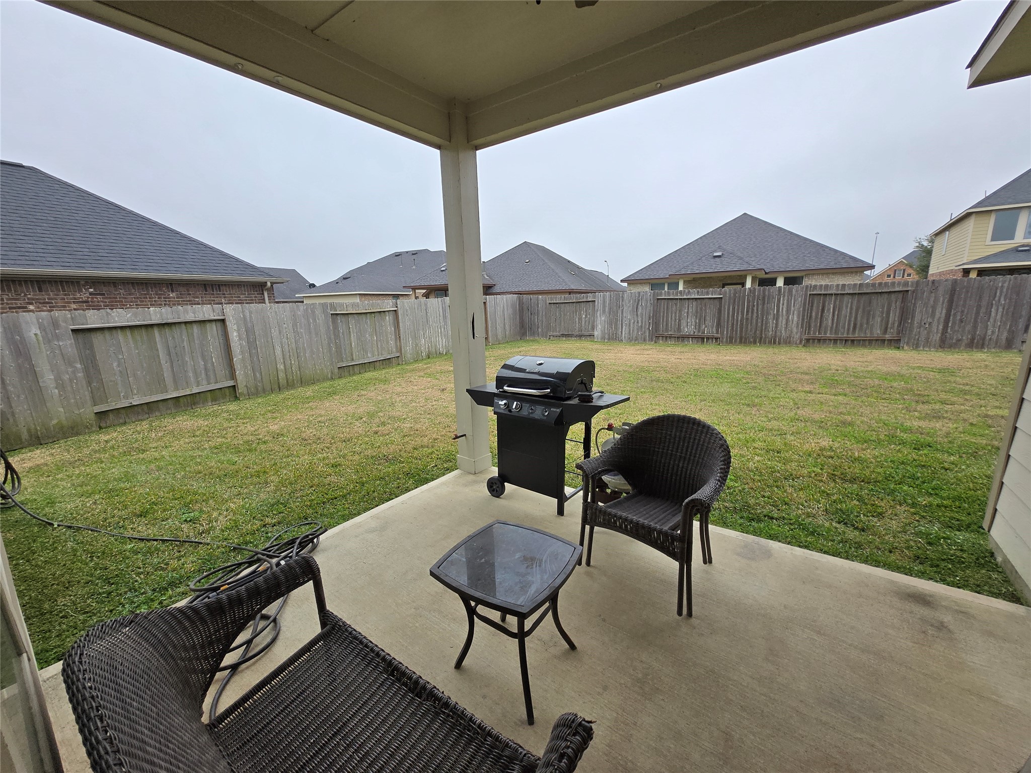 17451 Farm Pasture Trail Hockley, TX 77447 - Photo 21 of 27 a backyard of a house with table and chairs