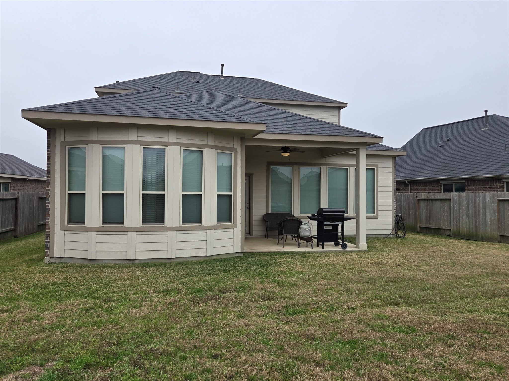 17451 Farm Pasture Trail Hockley, TX 77447 - Photo 24 of 27 a front view of house with yard outdoor seating and barbeque oven