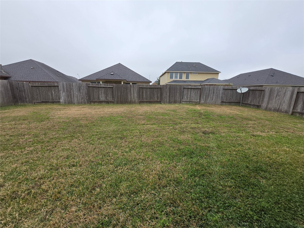 17451 Farm Pasture Trail Hockley, TX 77447 - Photo 25 of 27 a view of a house with wooden fence and two windows