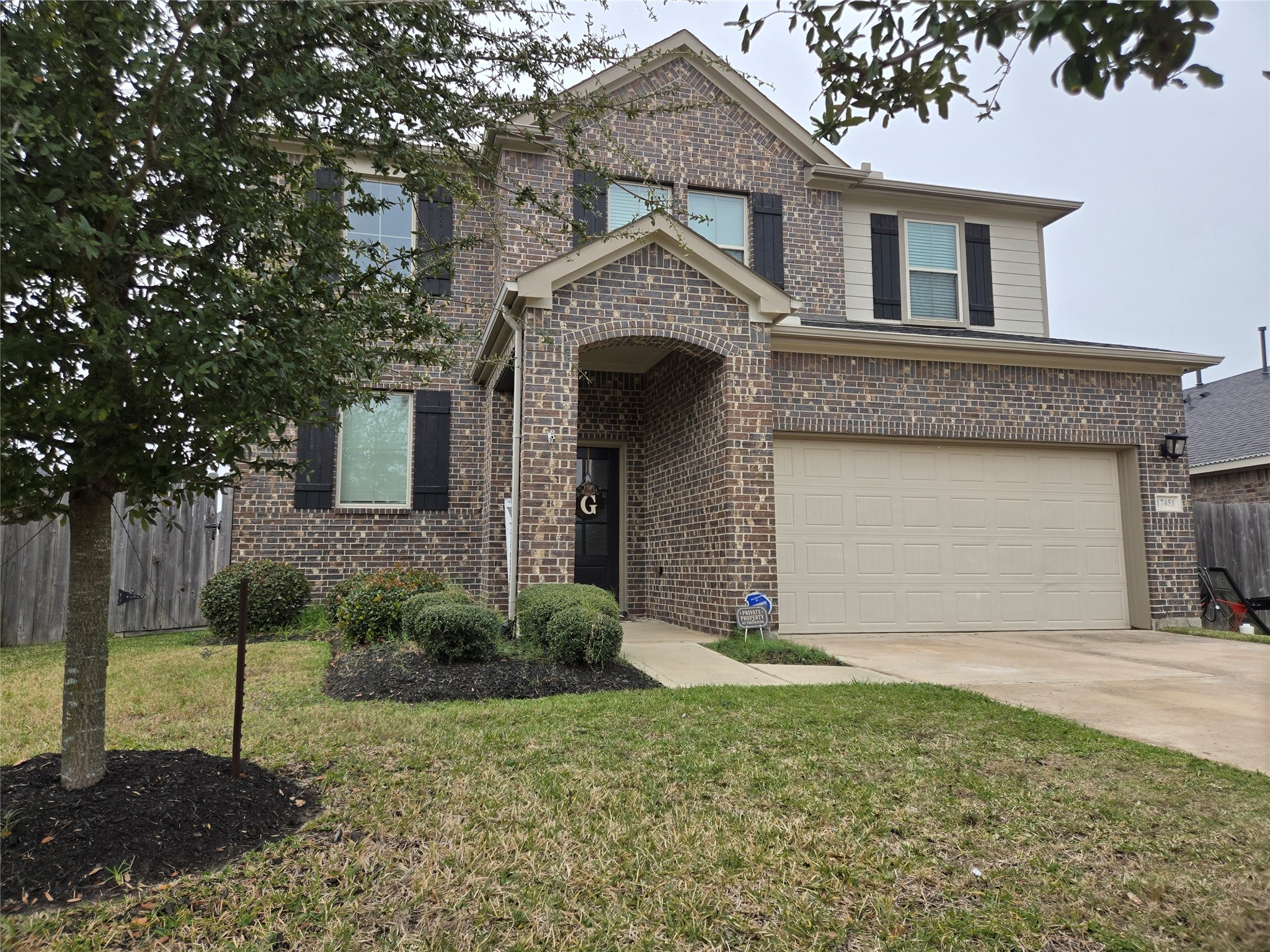 17451 Farm Pasture Trail Hockley, TX 77447 - Photo 26 of 27 a front view of a house with a yard and garage