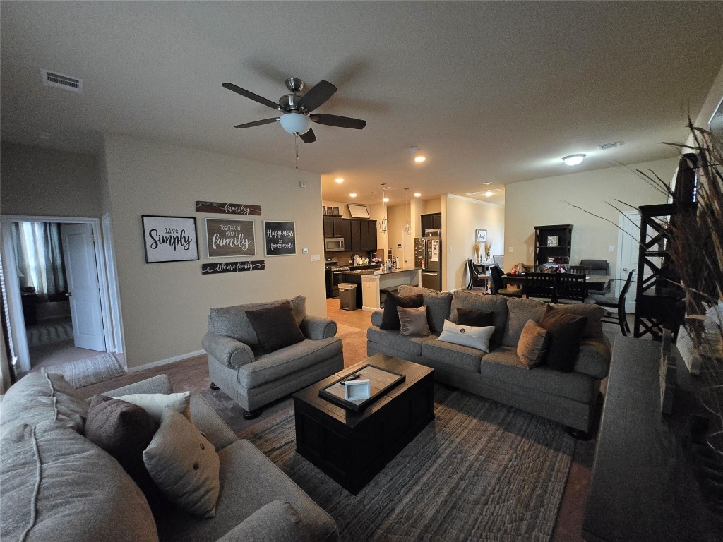 17451 Farm Pasture Trail Hockley, TX 77447 - Photo 6 of 27 a living room with furniture and a view of kitchen
