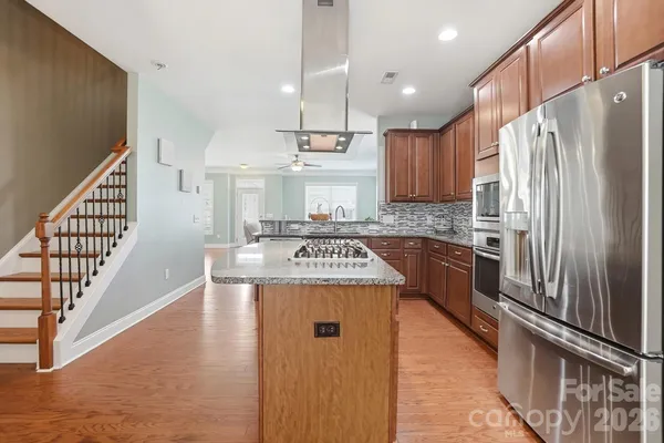 a spacious bedroom with a bed and a cabinets