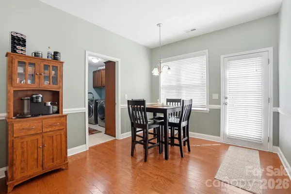 a bedroom with a bed and a refrigerator