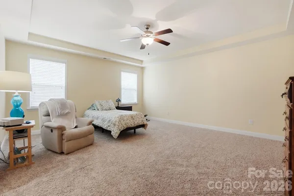 a view of walk in closet with clothes