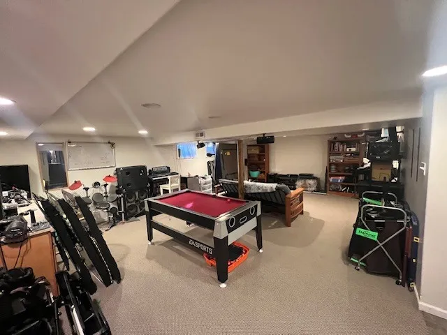 a living room with furniture gym equipment and a mirror