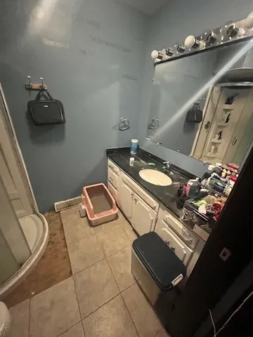 a bathroom with a sink and mirror