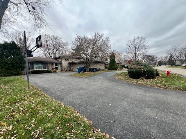 48 South Country Squire Road Palos Heights, IL 60463 - Photo 23 of 23 a view of a house with a cars park next to a road
