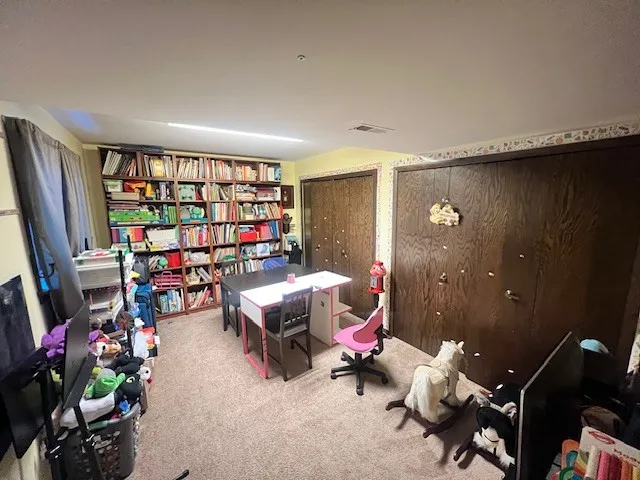 a living room with furniture a rug and a large window