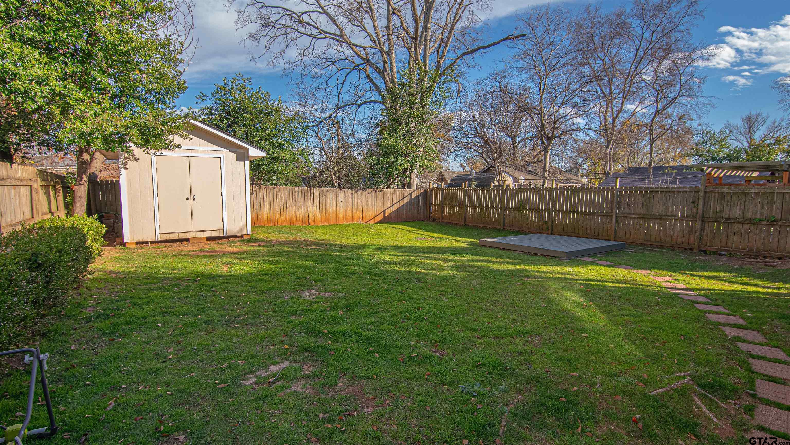 820 South Chilton Avenue Tyler, TX 75701 - Photo 18 of 20 a view of a backyard with a small cabin