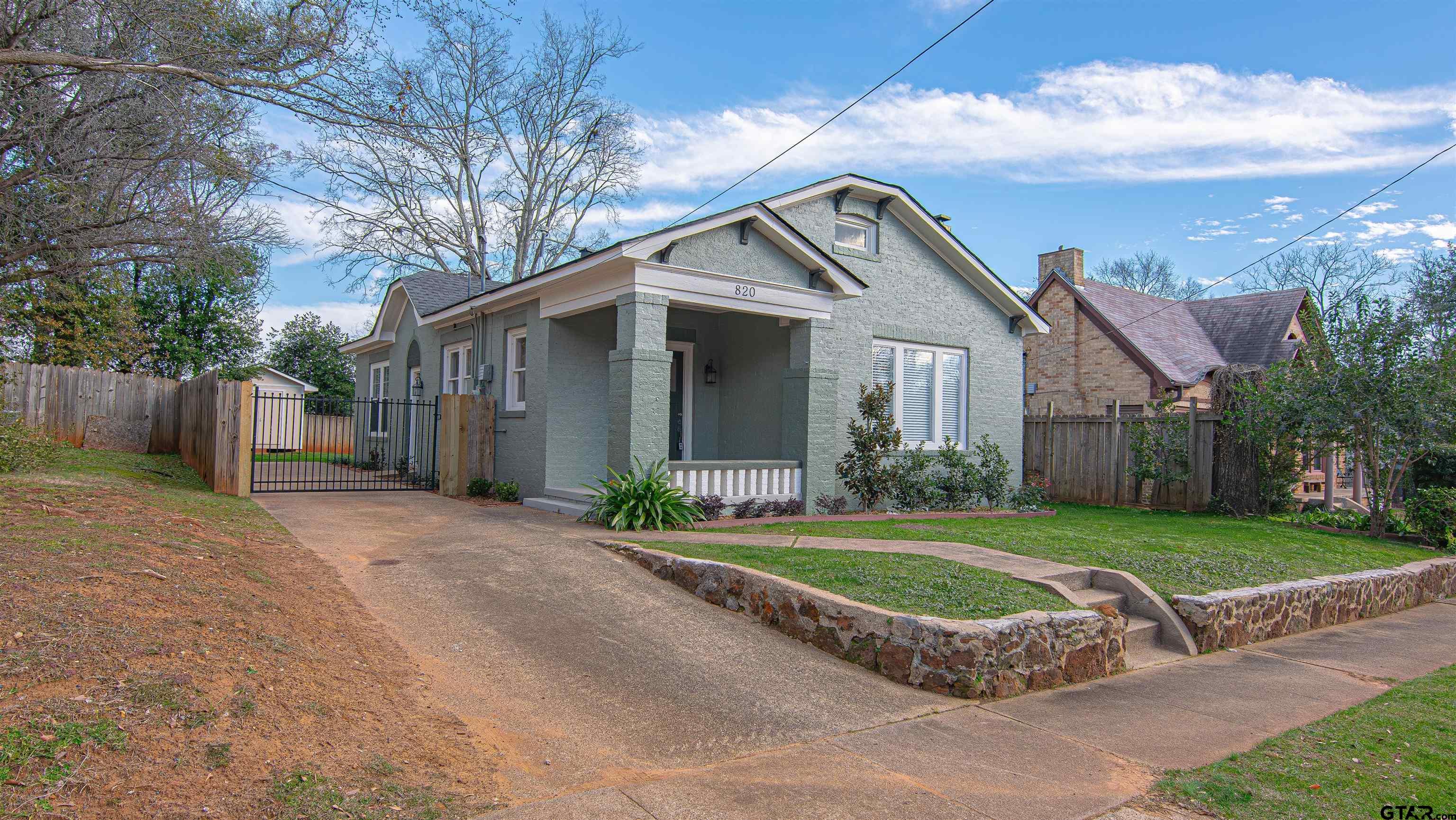 820 South Chilton Avenue Tyler, TX 75701 - Photo 2 of 20 a front view of a house with a yard and garage
