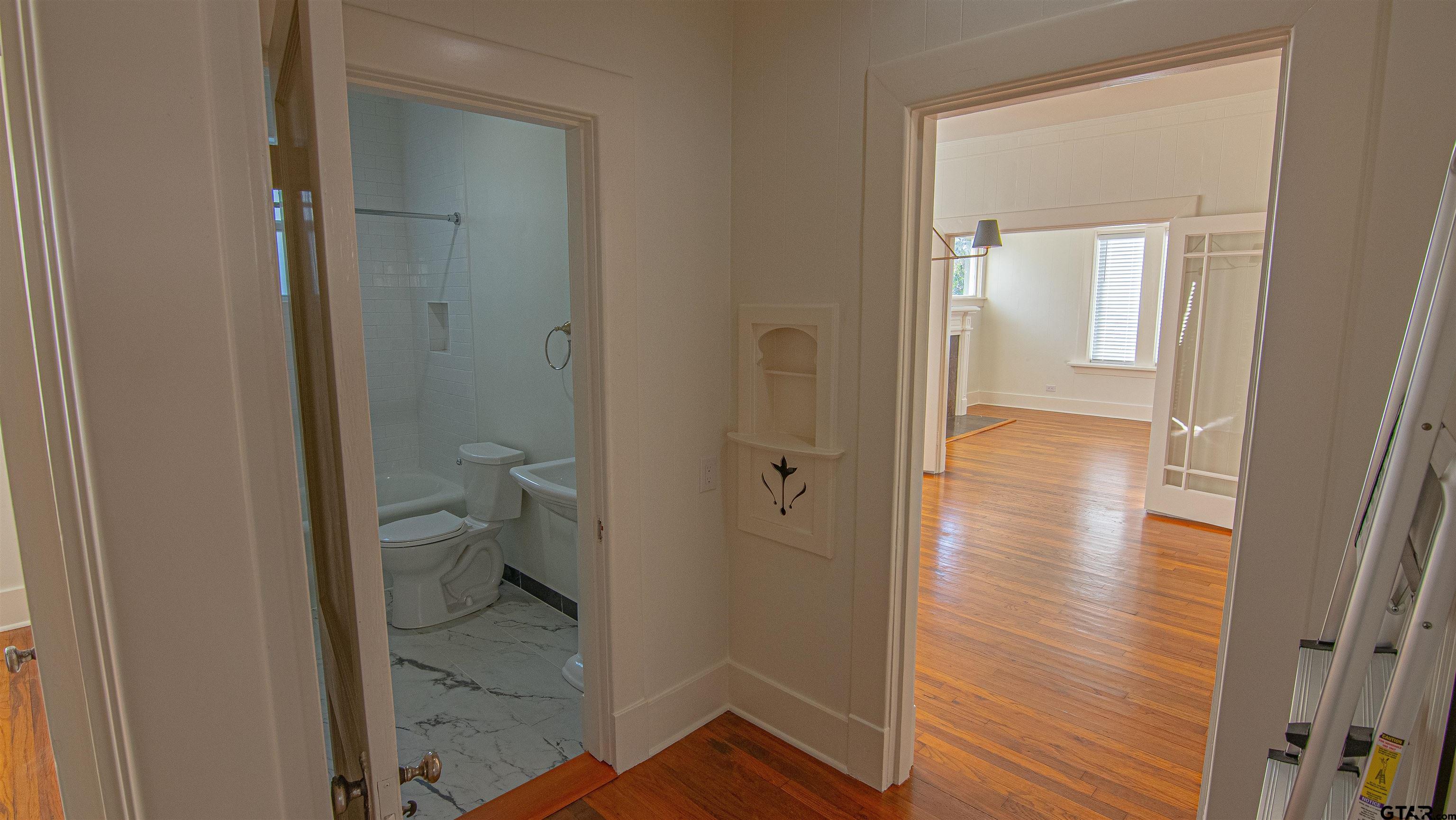 820 South Chilton Avenue Tyler, TX 75701 - Photo 10 of 20 a bathroom with a glass door shower