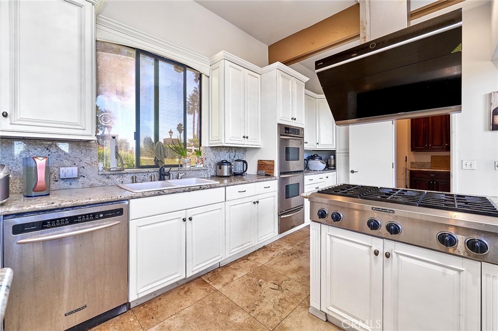 22702 Timbertop Lane Diamond Bar, CA 91765 - Photo 25 of 75 a kitchen with a stove a sink and a microwave