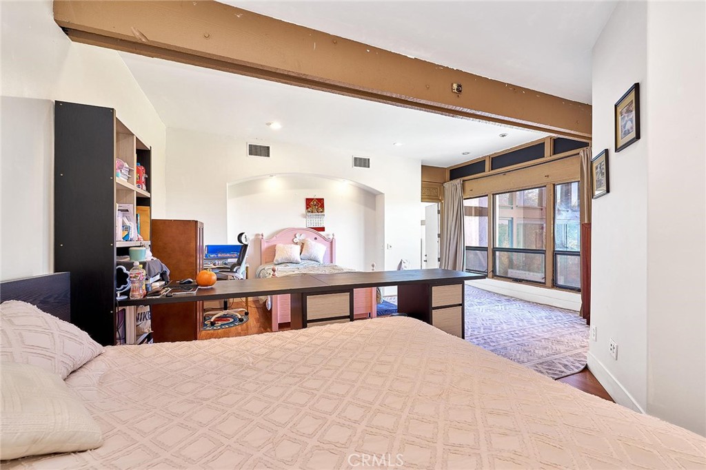 22702 Timbertop Lane Diamond Bar, CA 91765 - Photo 30 of 75 a bedroom with a large bed and a desk