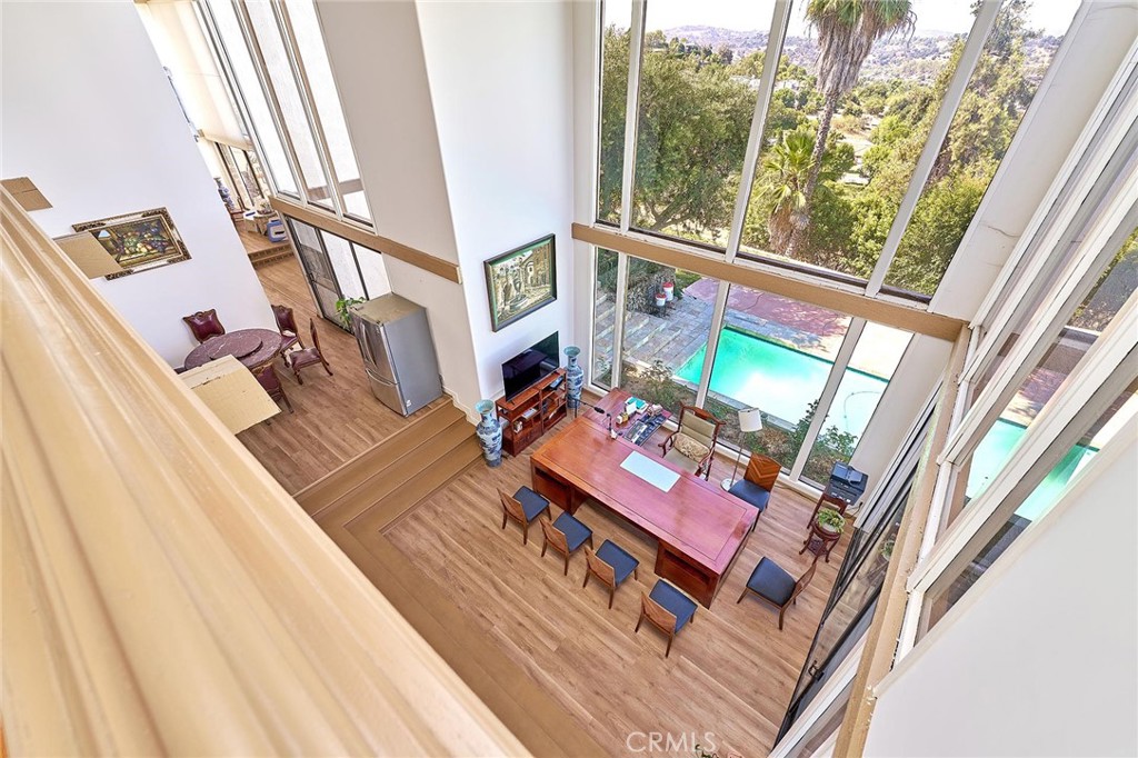 22702 Timbertop Lane Diamond Bar, CA 91765 - Photo 36 of 75 a living room with furniture and a floor to ceiling window