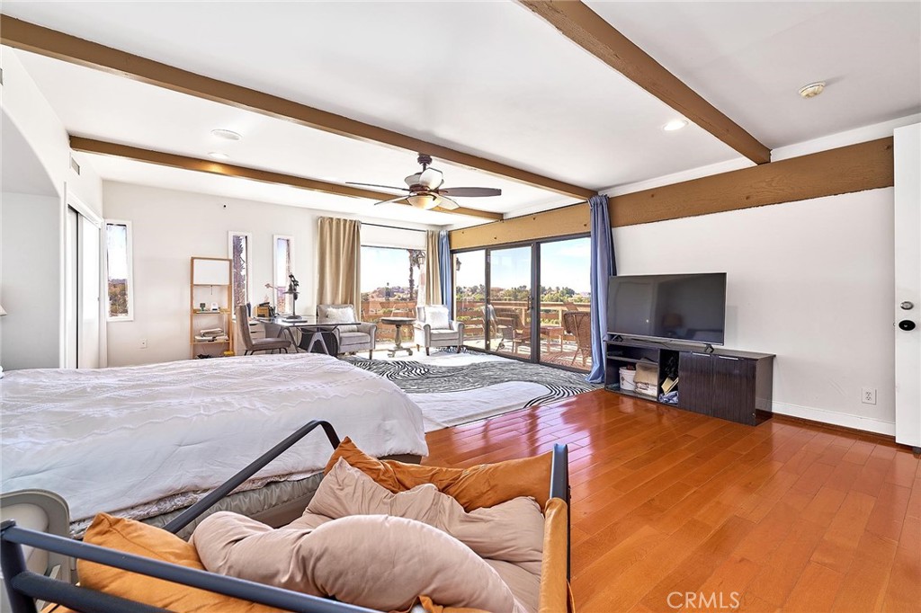 22702 Timbertop Lane Diamond Bar, CA 91765 - Photo 42 of 75 a living room with furniture a flat screen tv and a large window