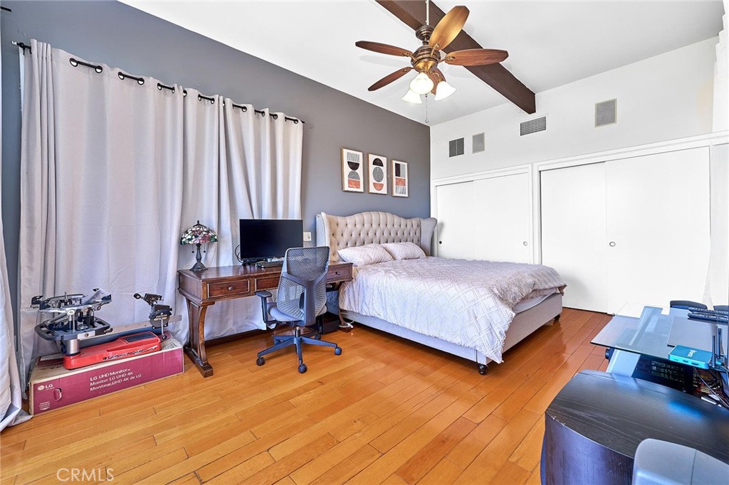 22702 Timbertop Lane Diamond Bar, CA 91765 - Photo 47 of 75 a bedroom with a bed and a chandelier