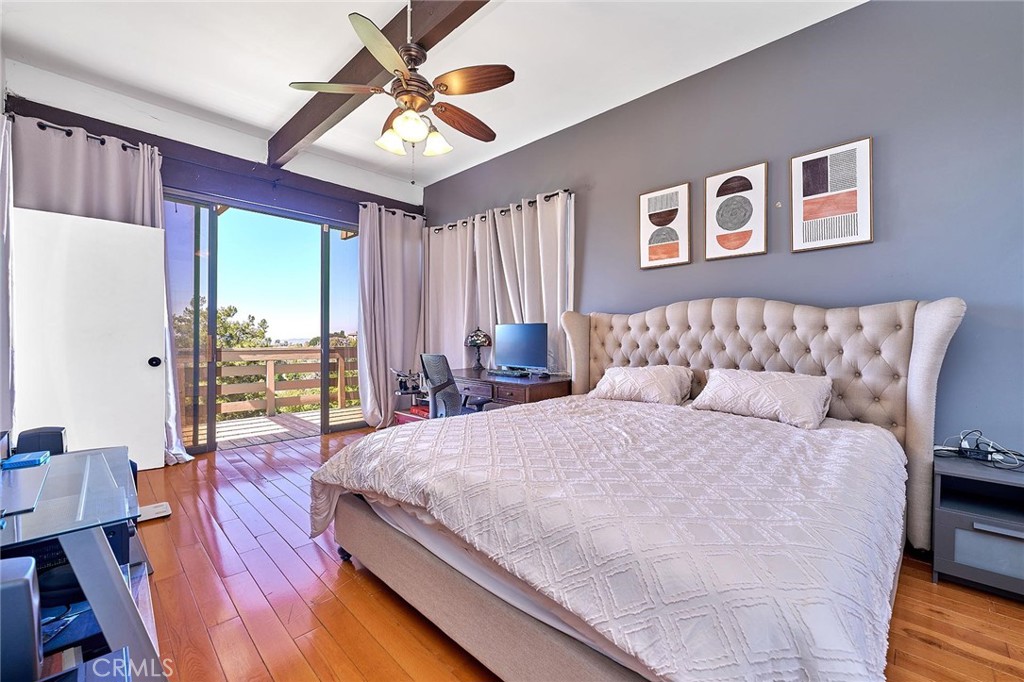 22702 Timbertop Lane Diamond Bar, CA 91765 - Photo 48 of 75 a bedroom with a large bed and a chandelier