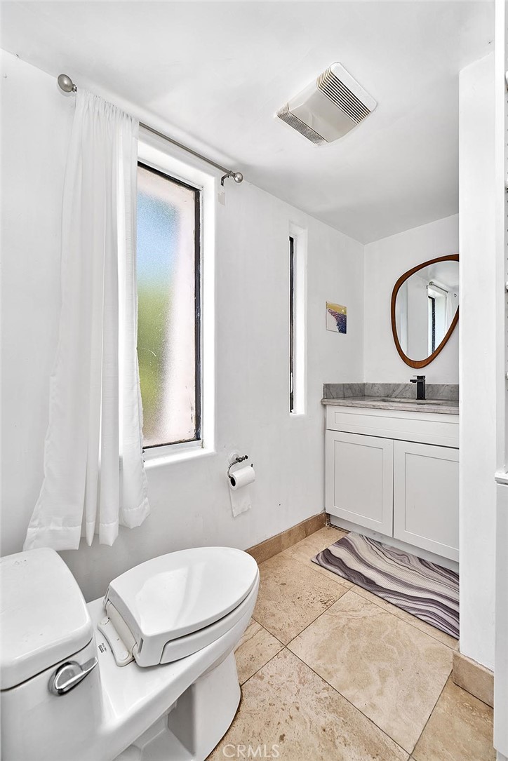 22702 Timbertop Lane Diamond Bar, CA 91765 - Photo 57 of 75 a bathroom with a sink a toilet and a mirror